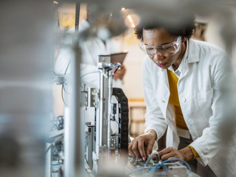 Technician assembling a medical device, illustrating the precision and customization offered by aftermarket parts manufacturers