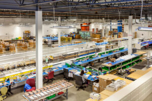 Illustration of contract manufacturing benefits, including cost reduction, quality control, supply chain, and fulfillment across the product lifecycle