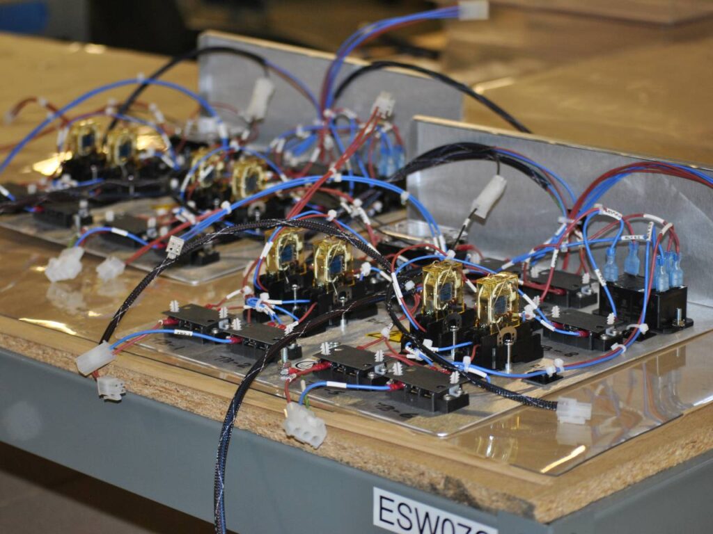 A complex box build sub-assembly with multiple PCBs and wiring harnesses, showing the importance of system-level integration.