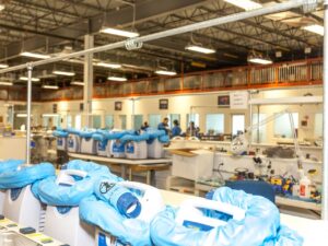 Completed medical devices staged for final inspection, highlighting the system integration and fulfillment stages of a transparent box build assembly process.