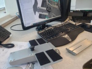 An engineer working on a 3D CAD model for a complex medical device, illustrating the strategy for the product development phase.