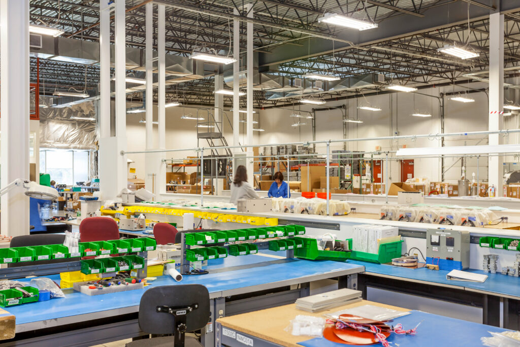 Organized warehouse bins holding bulk components for supplier managed inventory programs.