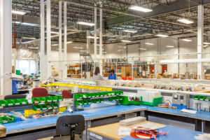 Organized warehouse bins holding bulk components for supplier managed inventory programs.