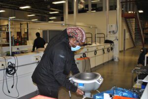 Engineer testing a medical device during the turnkey PCB assembly process.