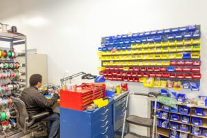 Technician at an active workstation using parts tracked by supplier managed inventory.